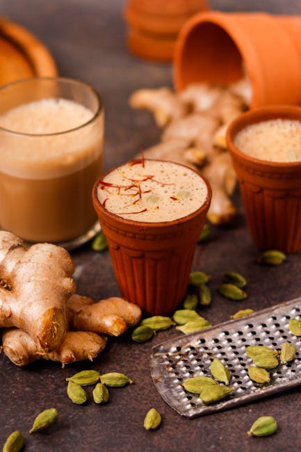 Masala chai in clay cups with ginger and cardamom